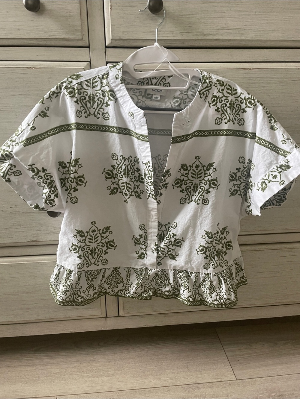 CeCe White Top with Olive Green Print and Ruffle Hem